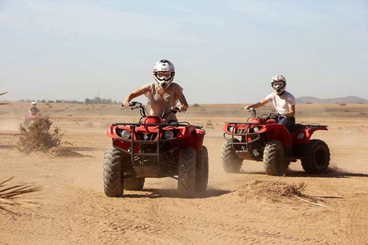 Group of quad bikes lined up ready to depart