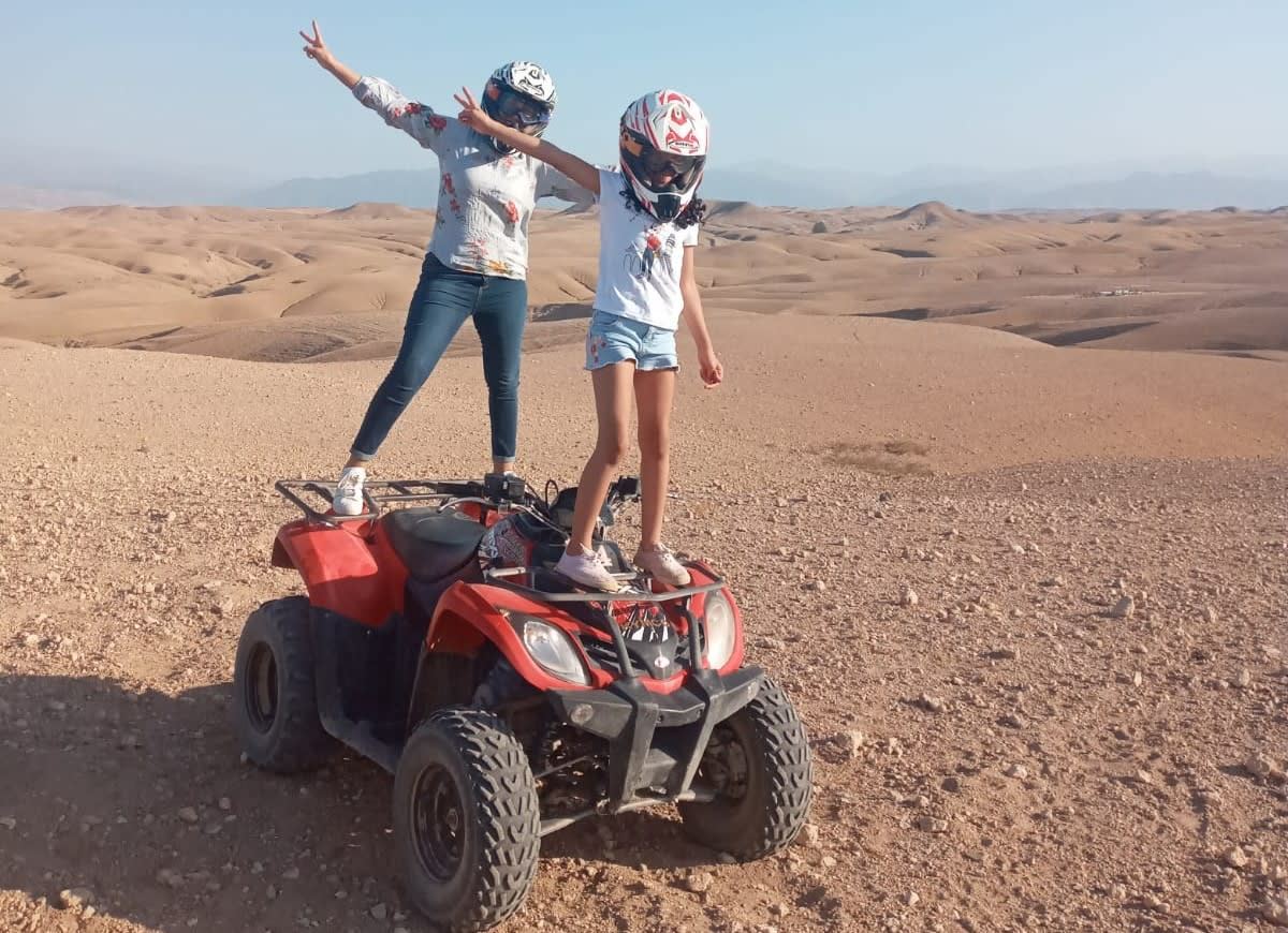 Mother and daughter standing on a quad in the Agafay Desert