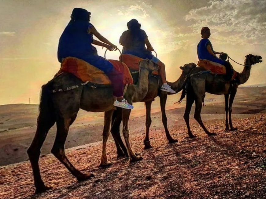 Riders silhouetted against the morning sky near Marrakech
